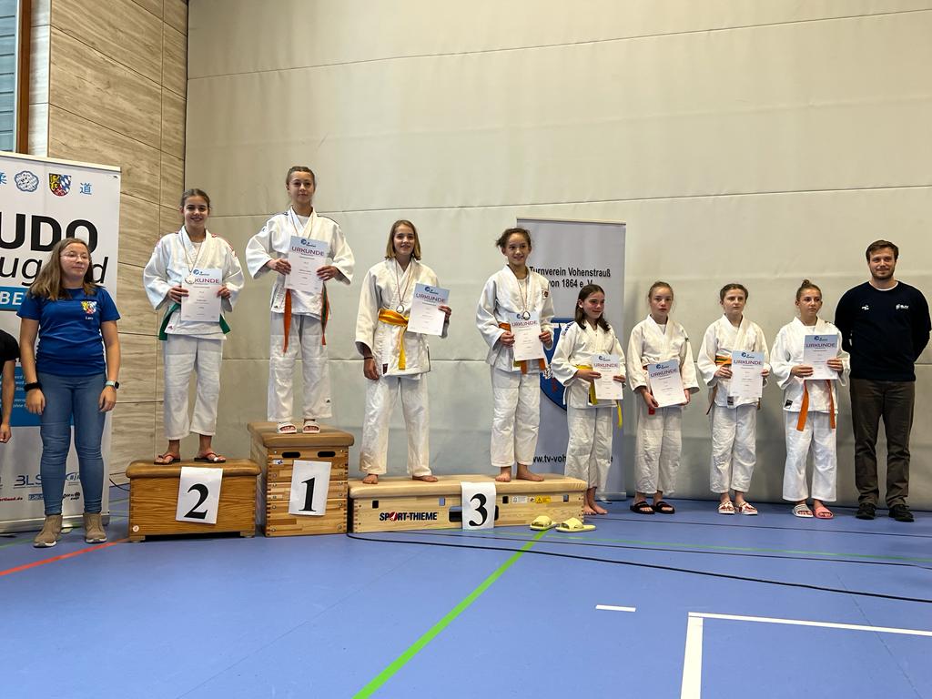 Judoka auf dem Siegertreppchen